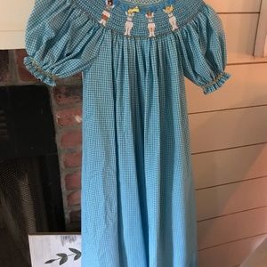 Adorable smocked blue dress with cheerleaders!